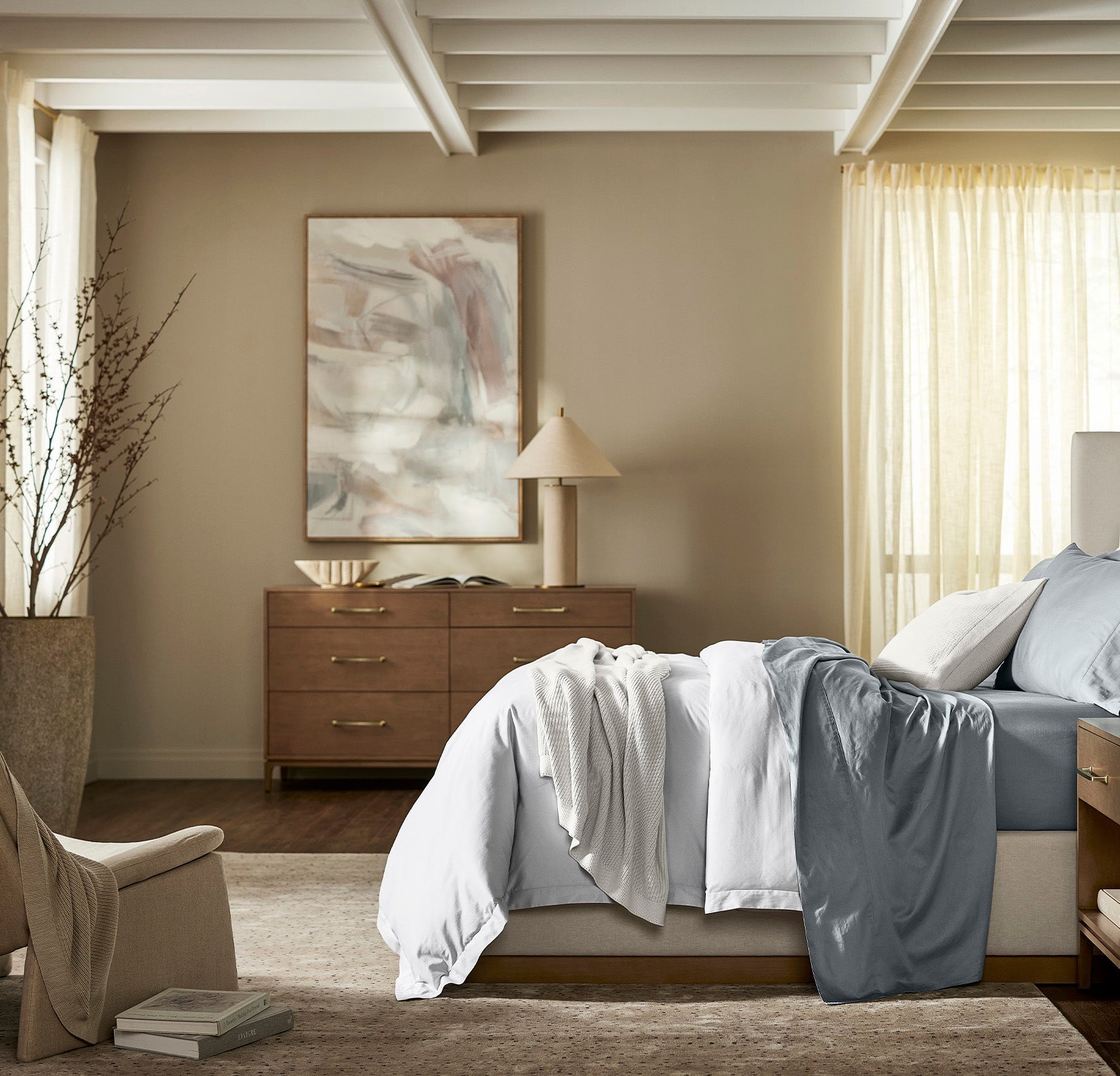 Lifestyle image of bed made with Signature Hemmed Sheet Set in Bluestone