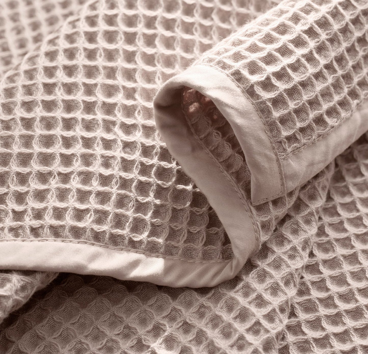 Detail image of bed made with Waffle Bed Blanket in Dusty Rose