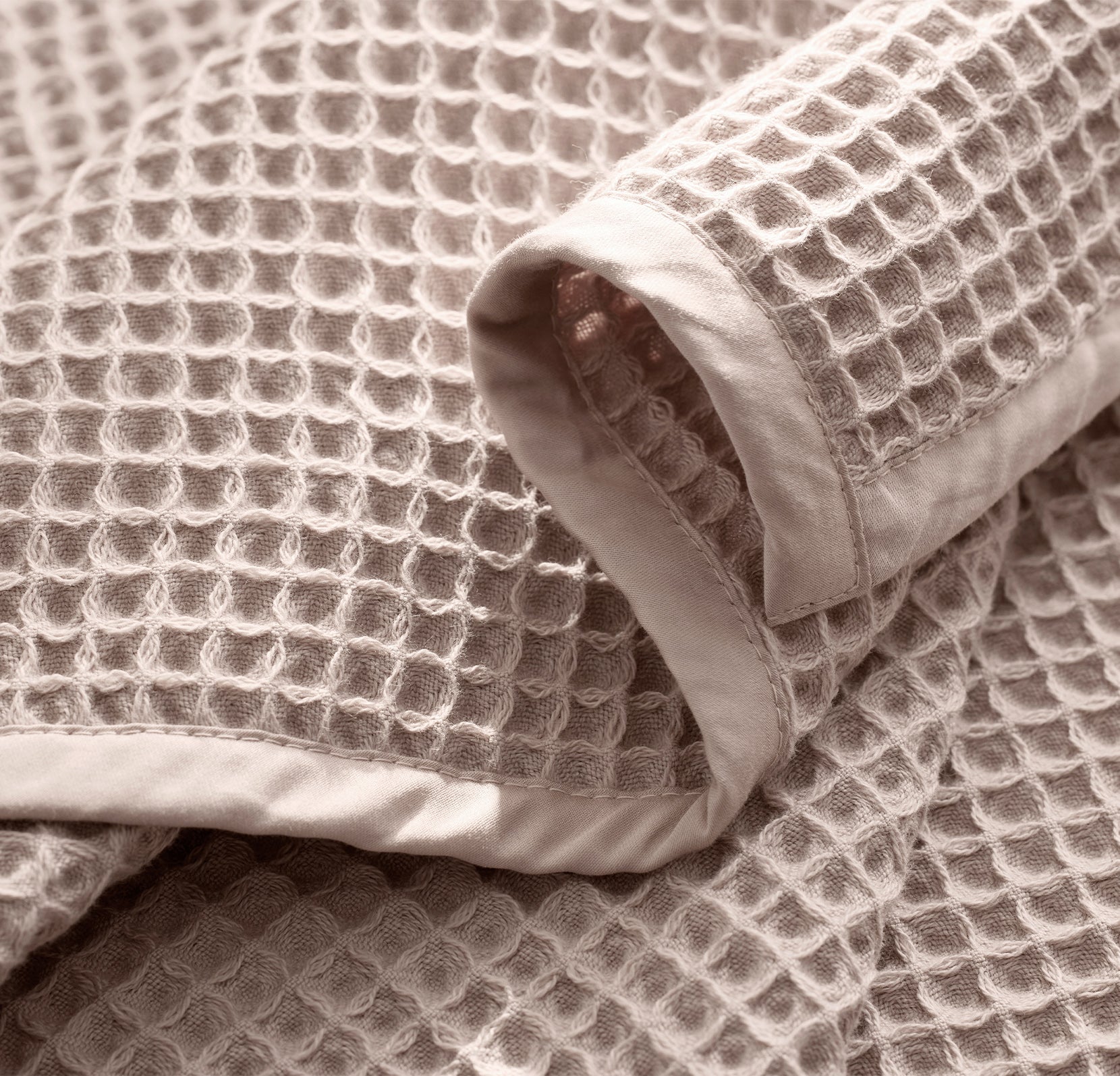 Detail image of bed made with Waffle Bed Blanket in Dusty Rose