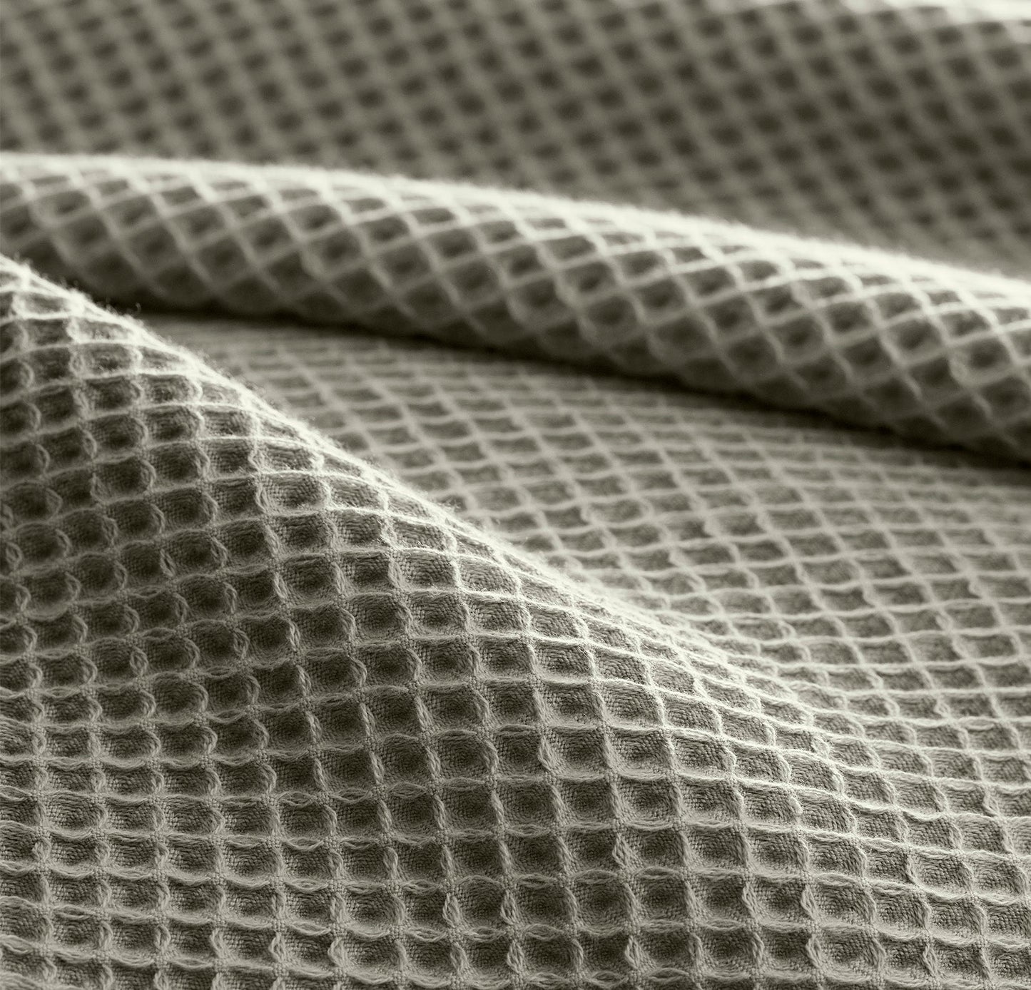 Detail image of bed made with Waffle Bed Blanket in Sageleaf
