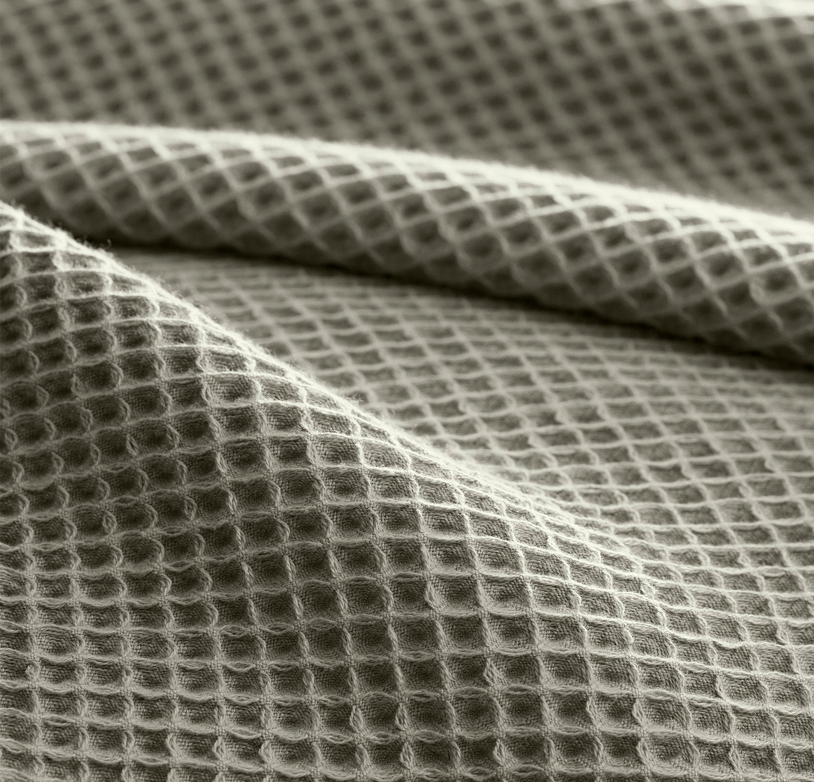 Detail image of bed made with Waffle Bed Blanket in Sageleaf