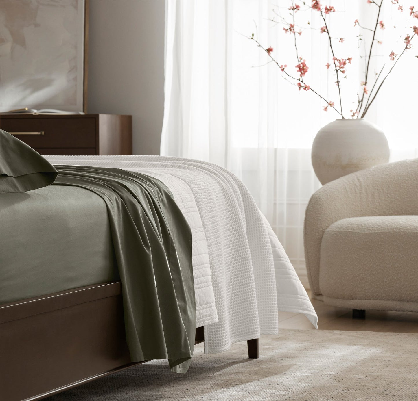 Detail image of bed made with Sheet Set in Juniper