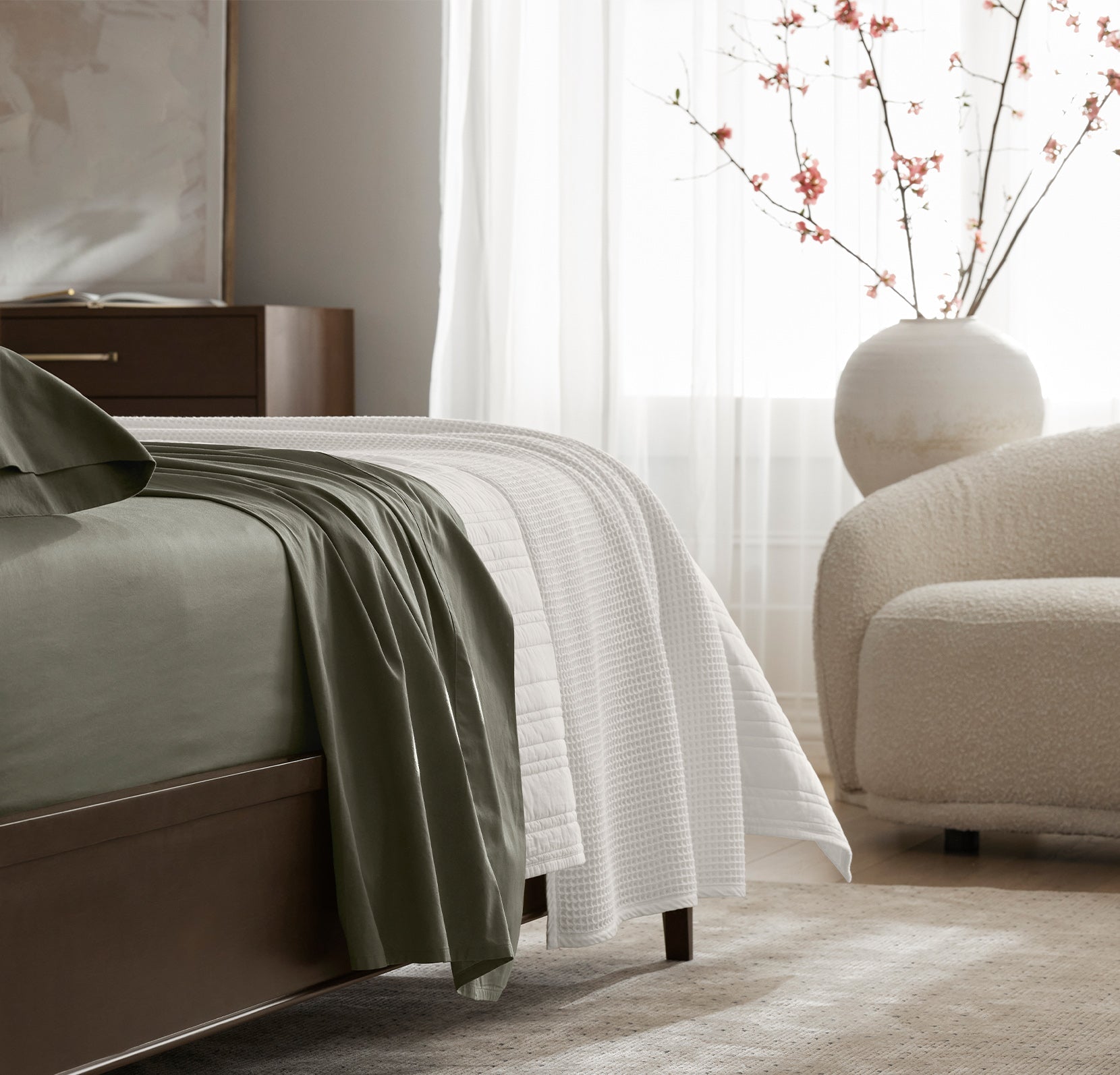 Detail image of bed made with Sheet Set in Juniper
