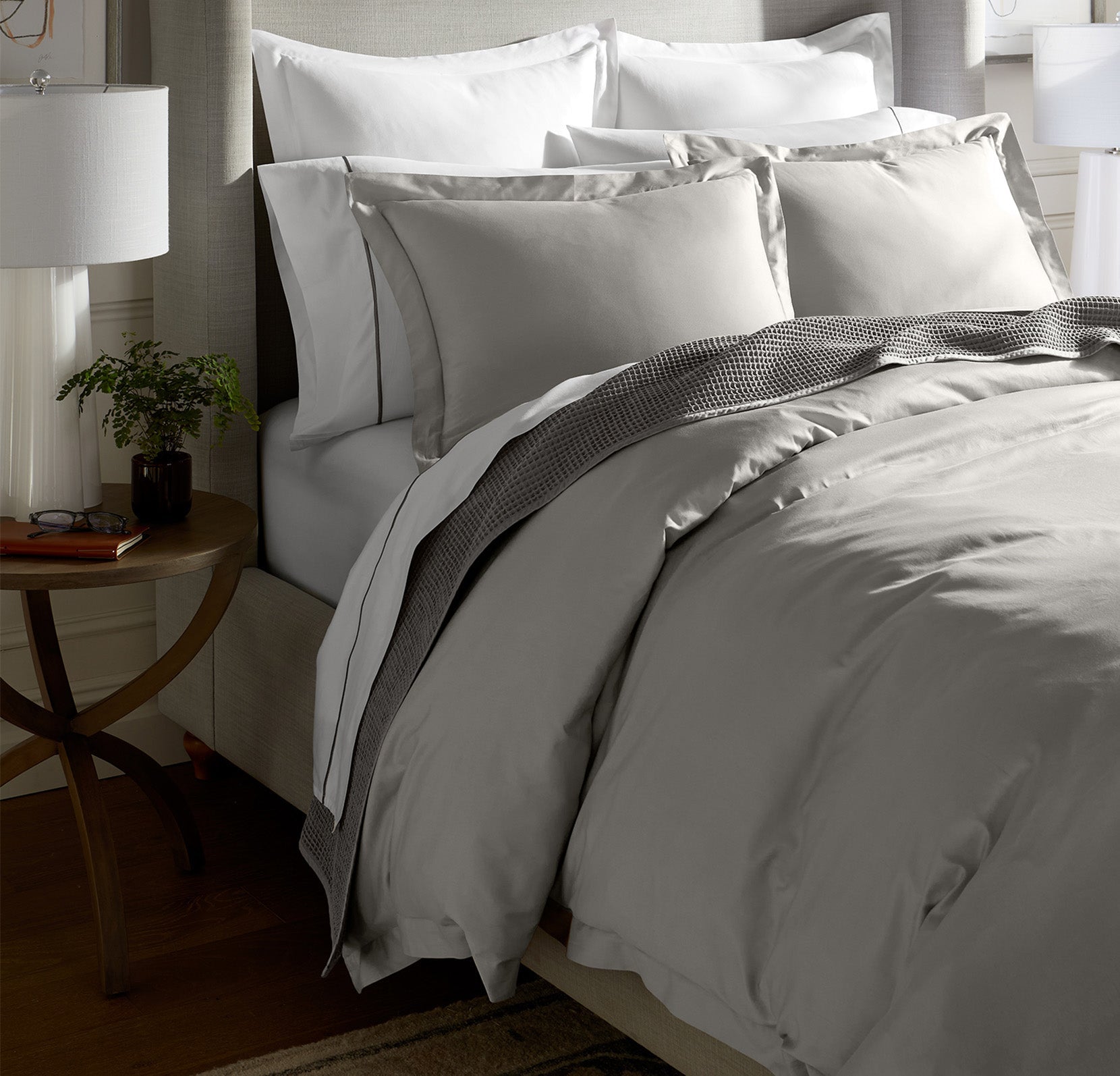 Lifestyle image of bed made with Hemmed Duvet Set in Pewter