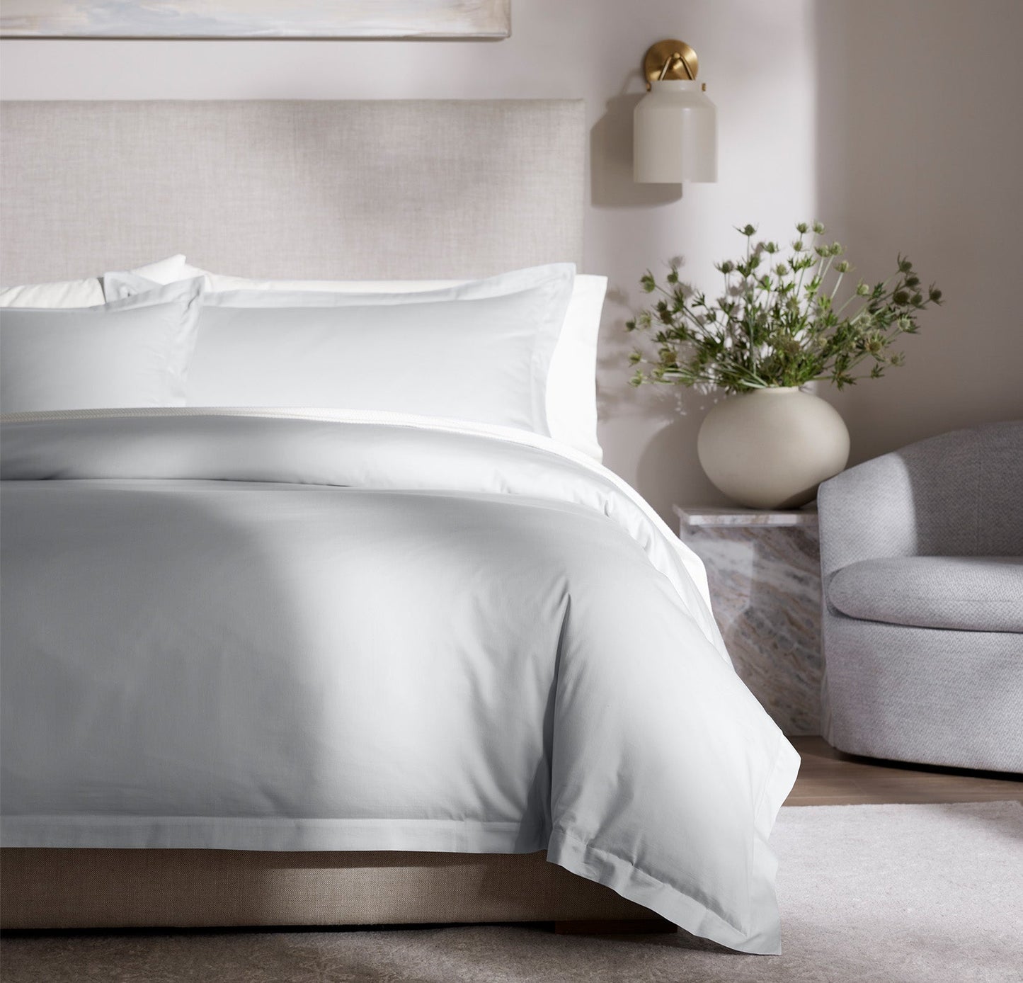 Lifestyle image of bed made with Hemmed Duvet Set in Sky