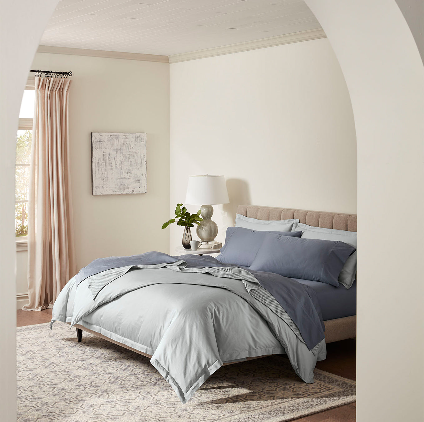 Lifestyle image of bed made with Sheet Set in Mineral