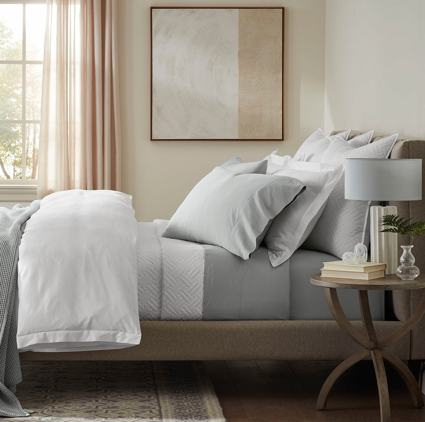 Lifestyle image of bed made with Sheet Set in Shore