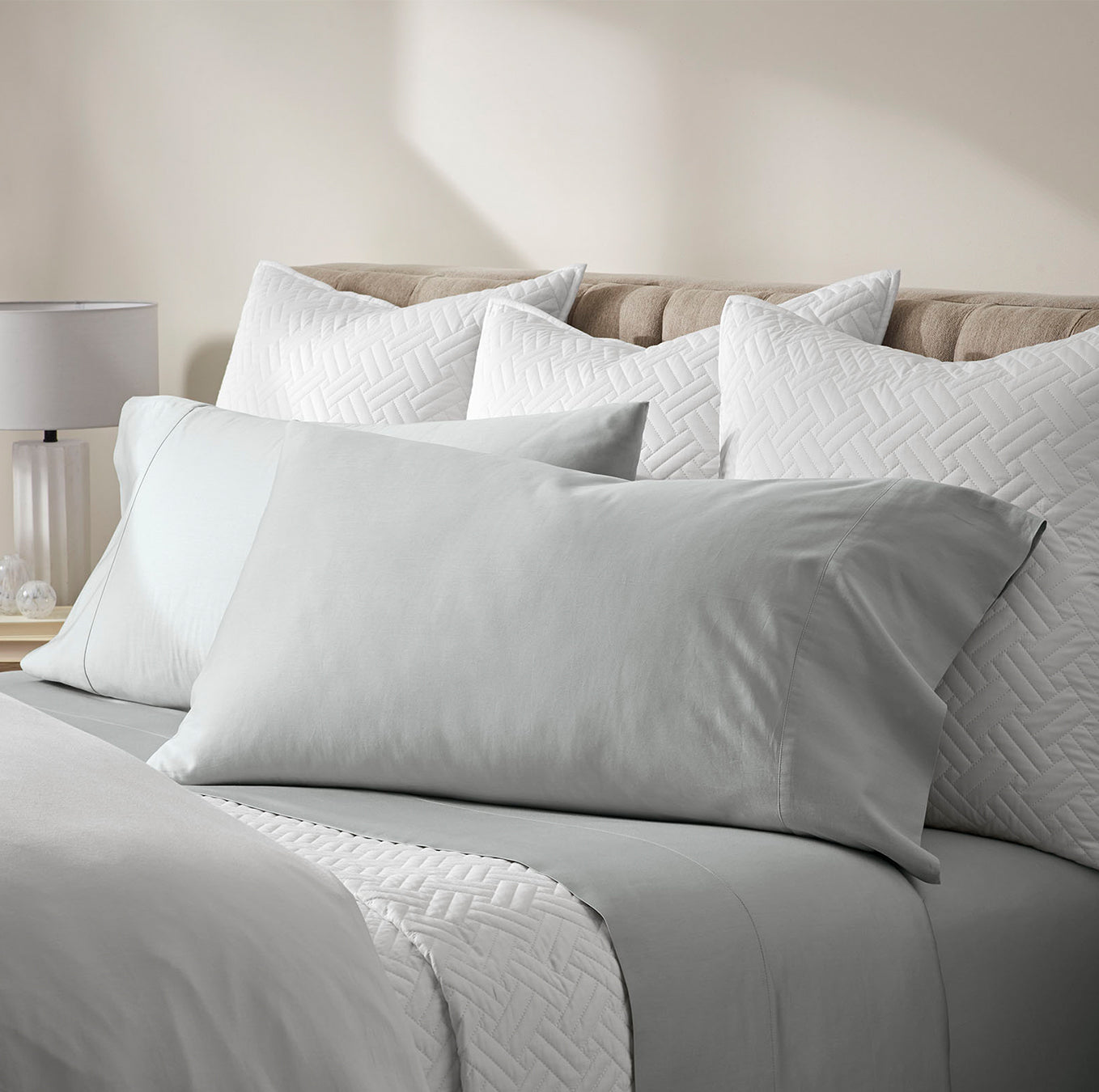Lifestyle image of bed made with Sheet Set in Shore
