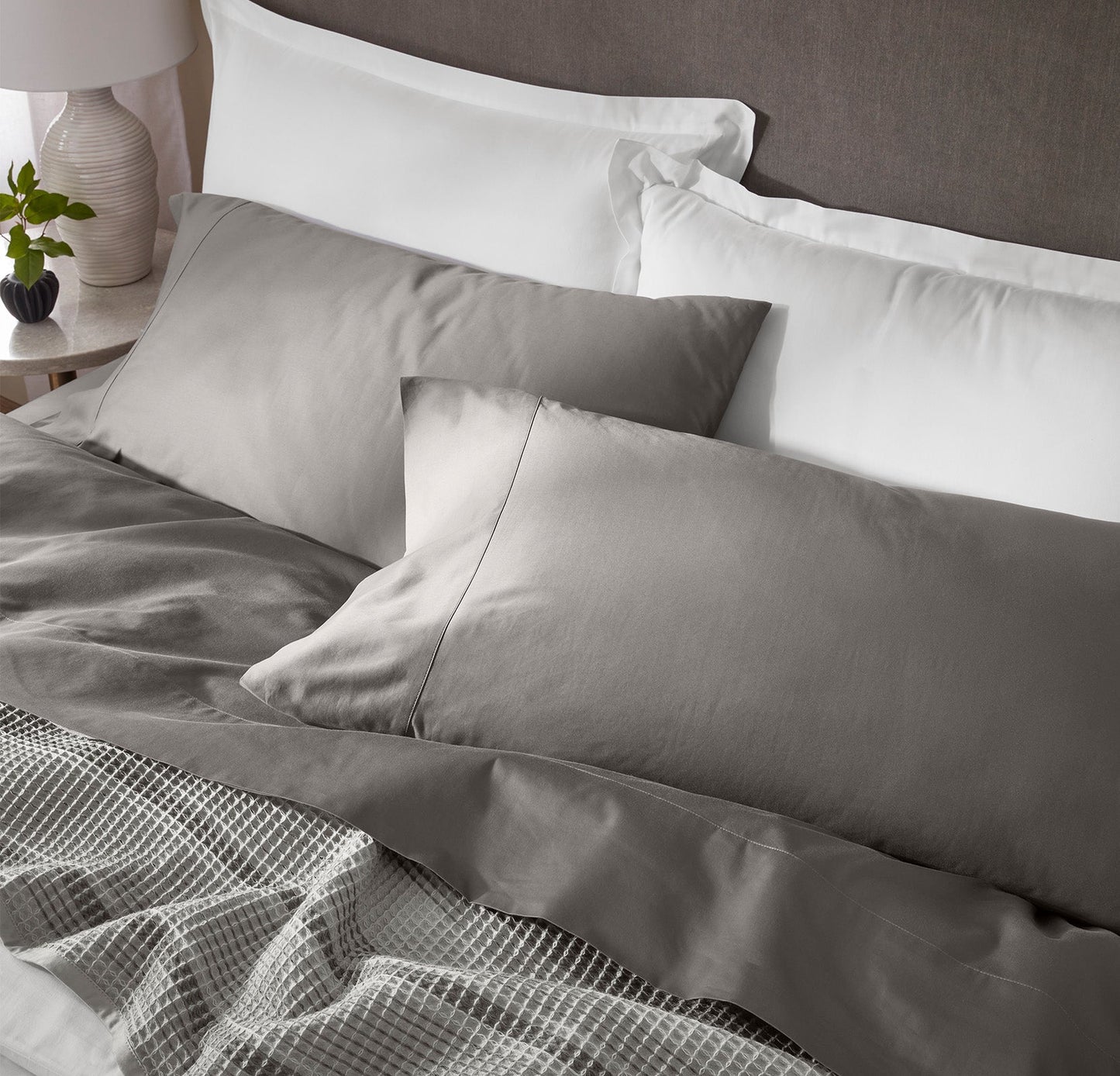 Detail image of bed made Sheet Set in Stone