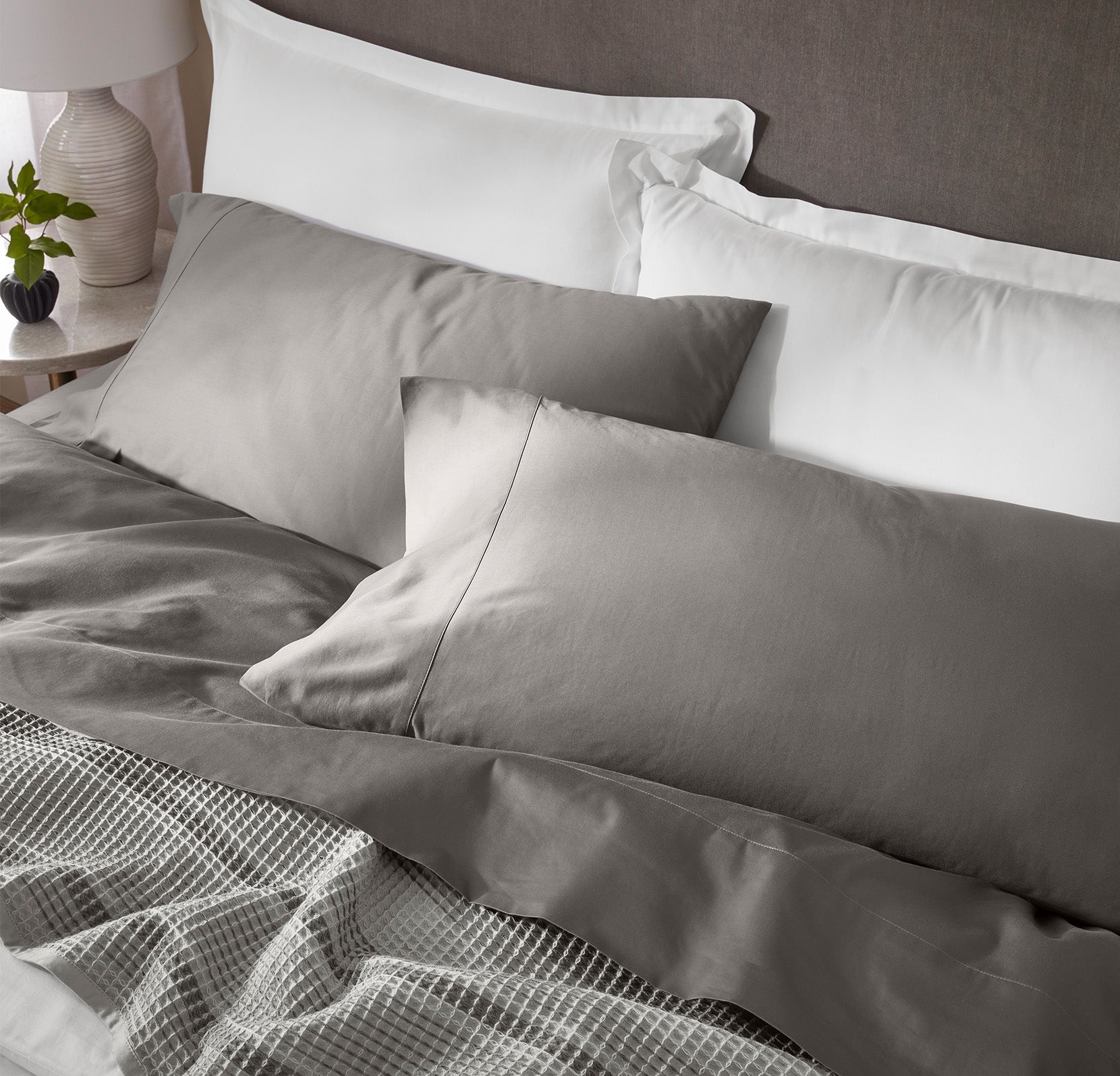 Detail image of bed made Sheet Set in Stone