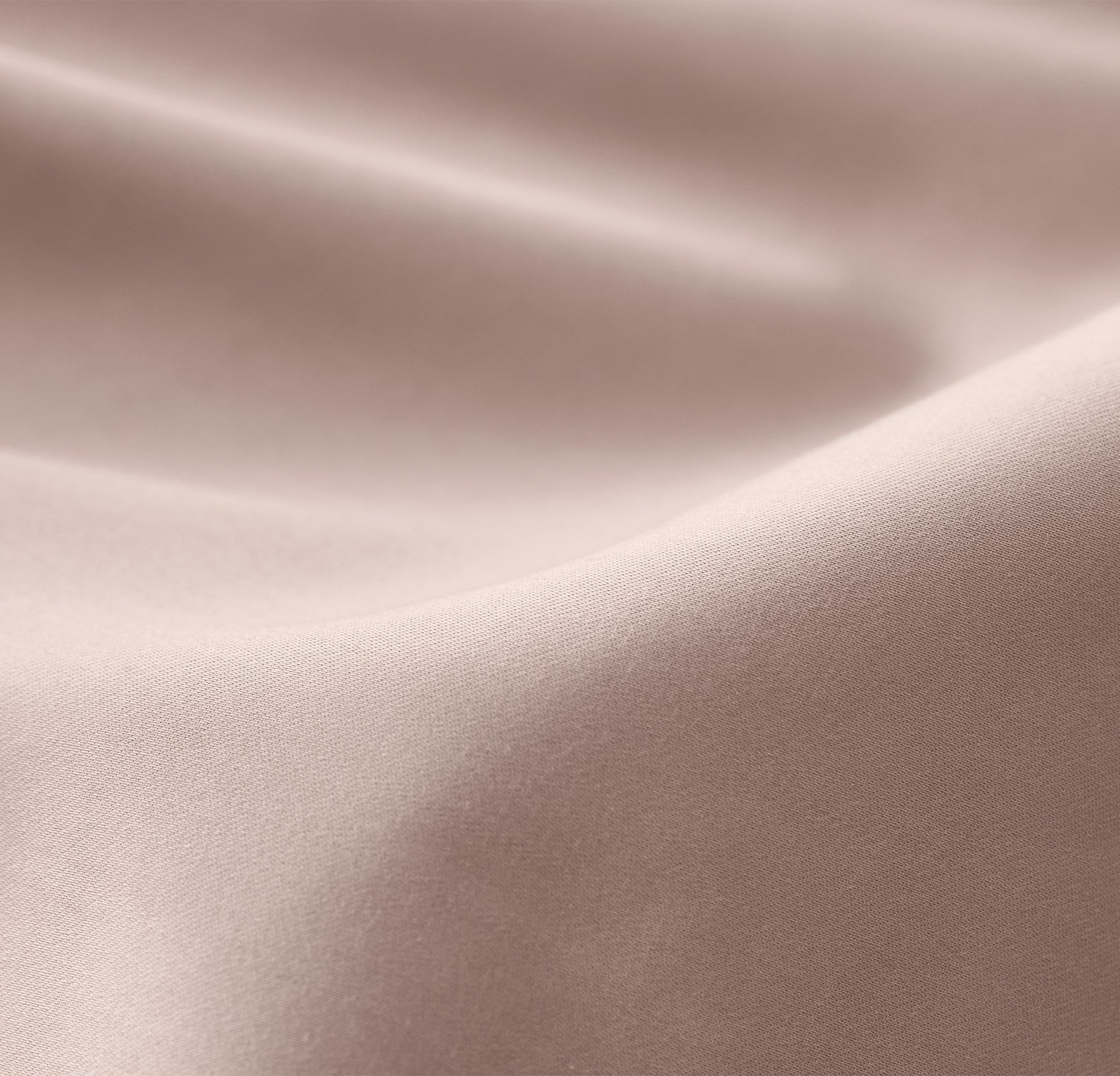Close up detail of bed made with Signature Hemmed Sheet Set in Dusty Rose