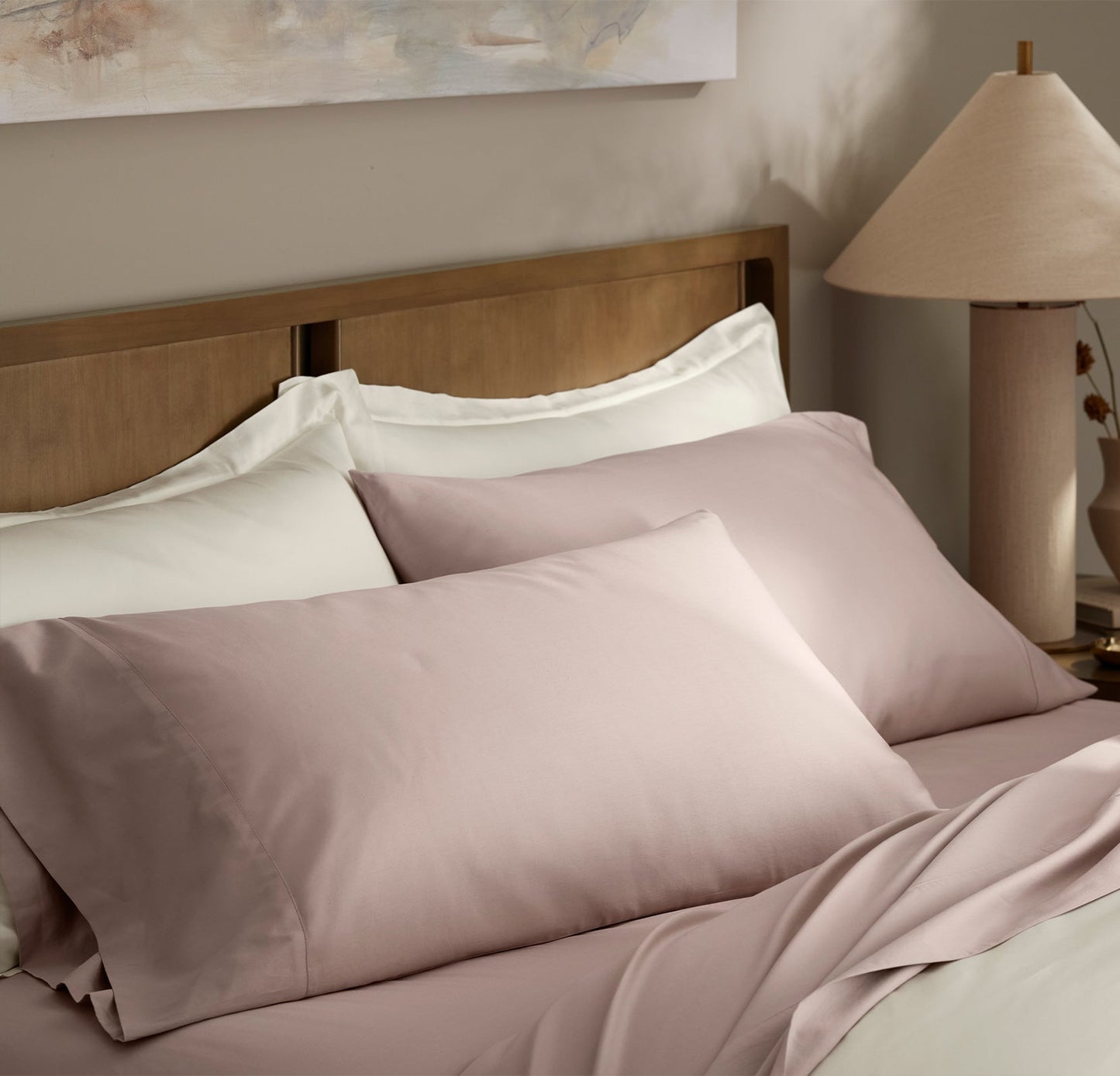 Lifestyle image of bed made with Signature Hemmed Sheet Set in Dusty Rose