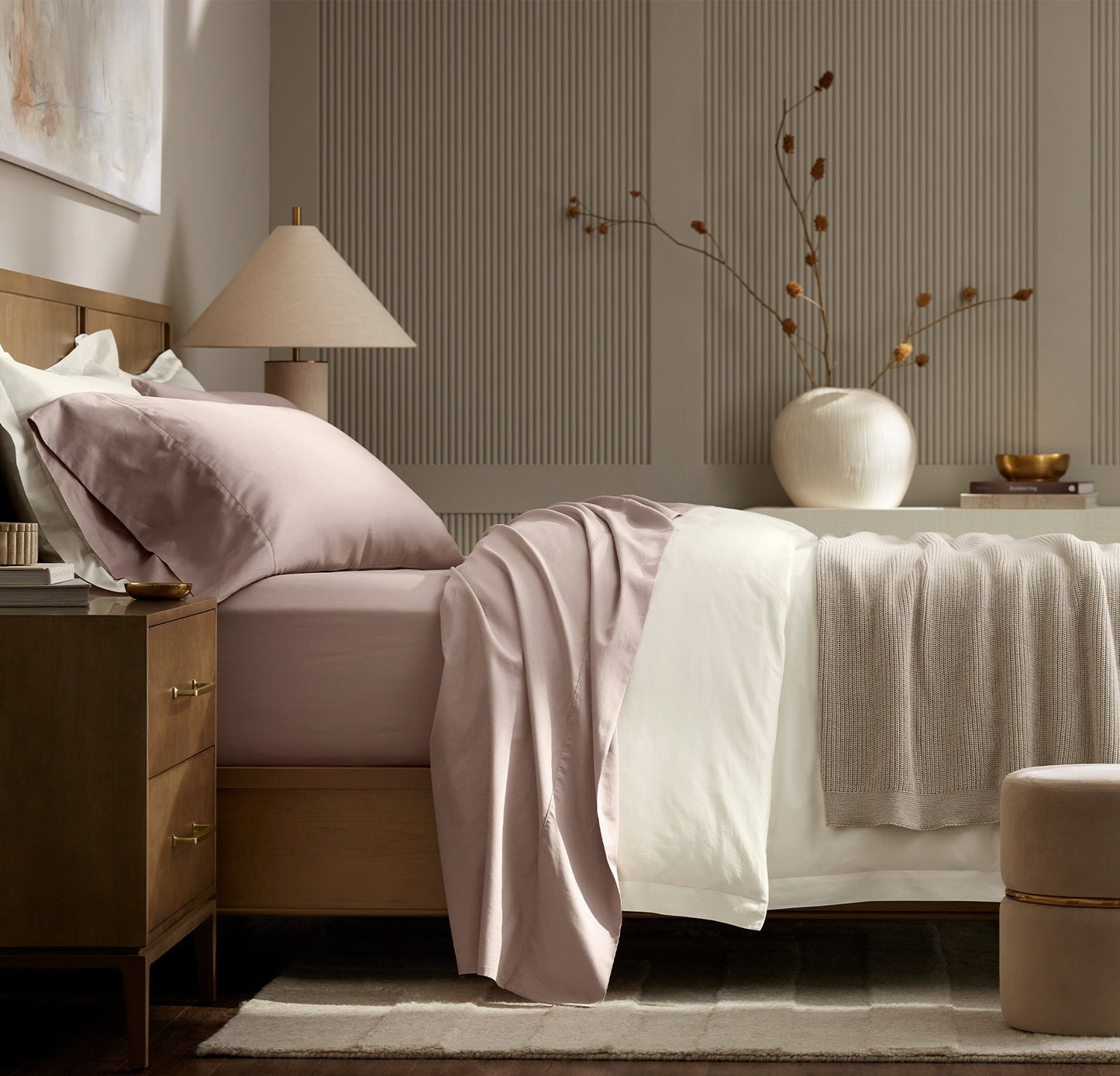 Lifestyle image of bed made with Signature Hemmed Sheet Set in Dusty Rose