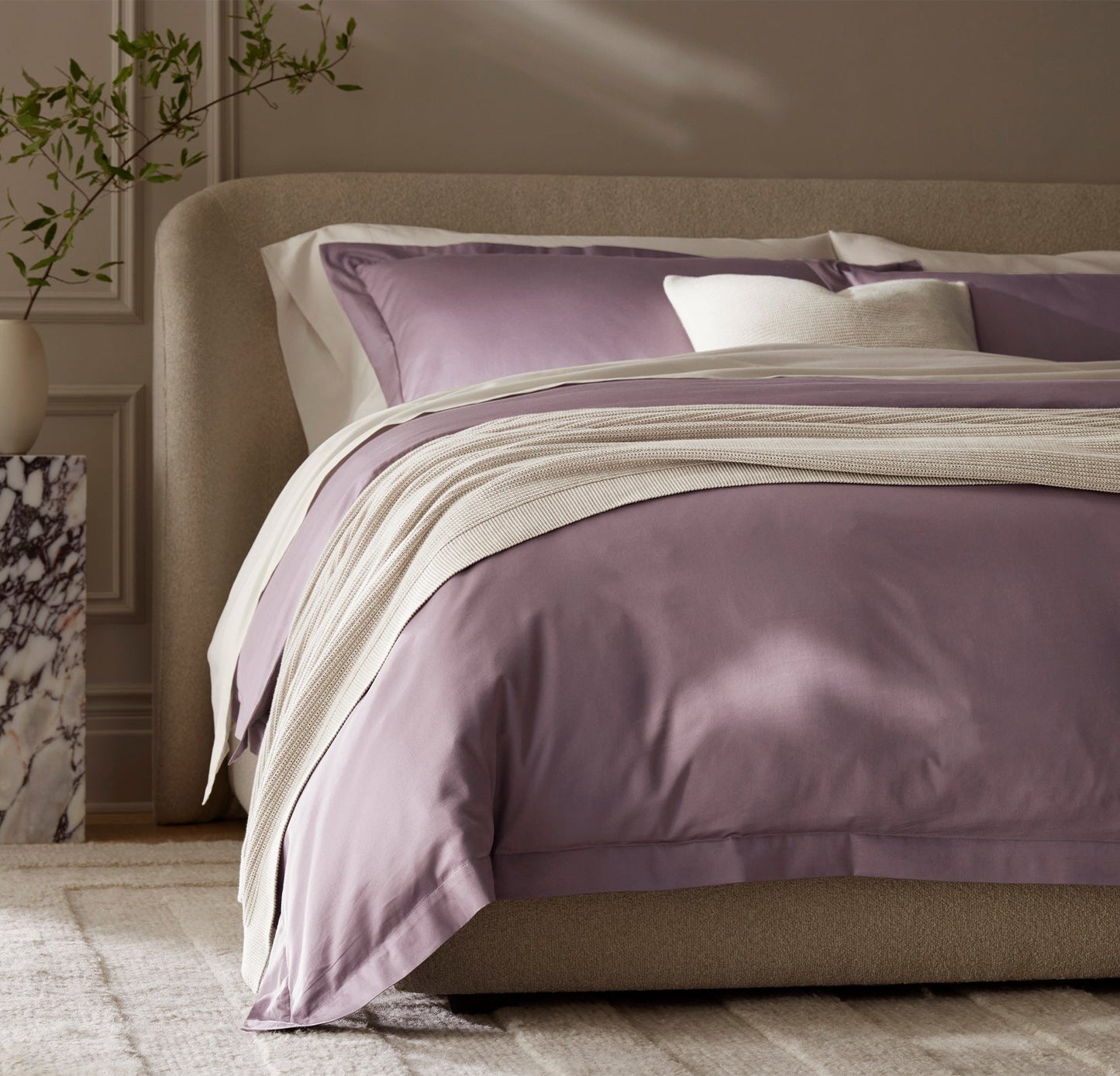 Detail image of bed made with Signature Hemmed Duvet Set in Plum