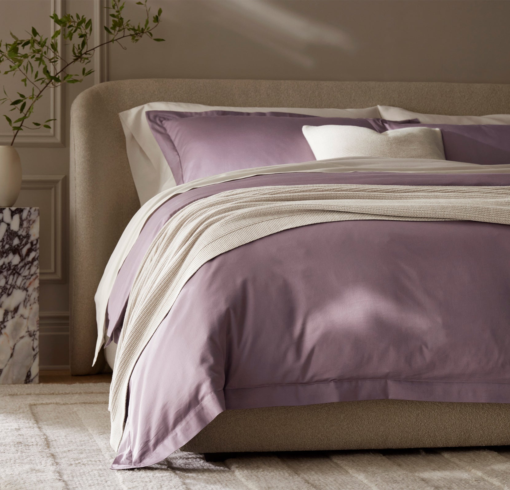 Detail image of bed made with Signature Hemmed Duvet Set in Plum